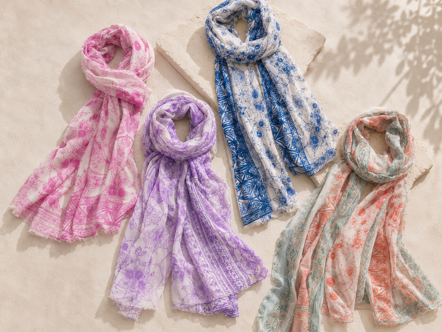 Printed cotton and viscose scarves in pastel colours